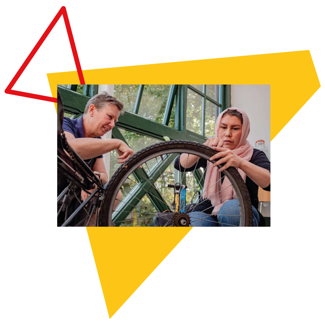 Woman learning bike maintenance